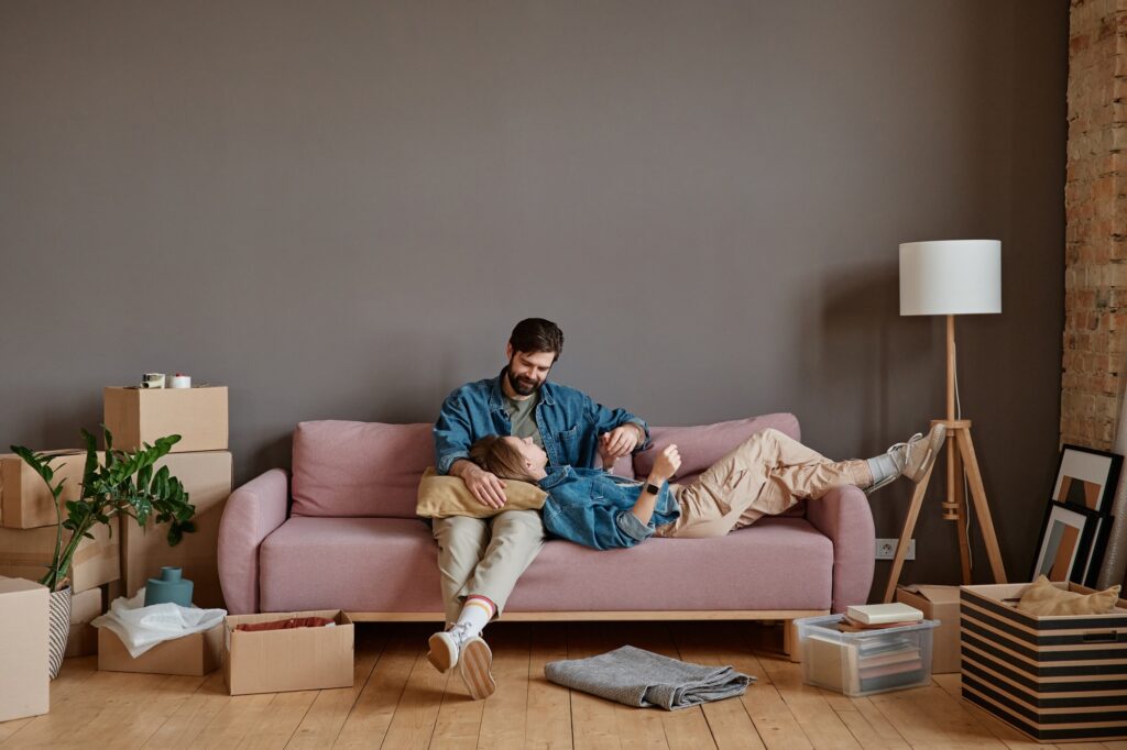 Couple Relaxing In New Apartment